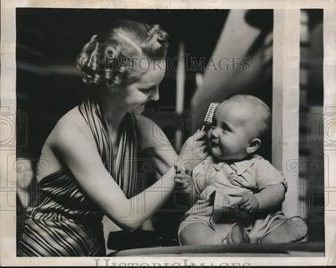 1939 Press Photo Model Brushes a Baby's Hair at Hair & Beauty Fair in London Cheap Sale Outlet