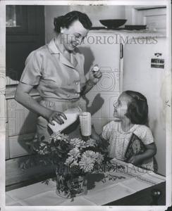 1951 Press Photo Mother Child Milk Glass Bottel Low Pice Fee Shipping For Sale