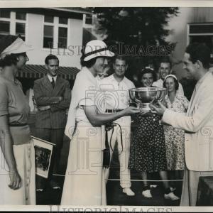 1938 Press Photo Fred Waring presents trophy to Charlotte Glutting at tennis Deals Cheap Pice