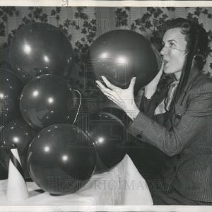 1954 Press Photo Mrs. William McCaughey Blows Balloons Mardi Gras Party Sale 2025 Unisex