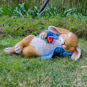 Garden Statue Sleeping Bunny Holding Flower Online For Sale